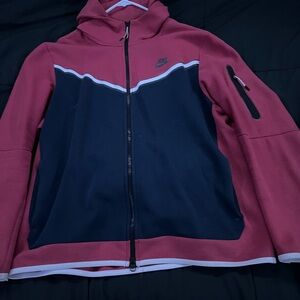 Red,white, and blue Nike Tech